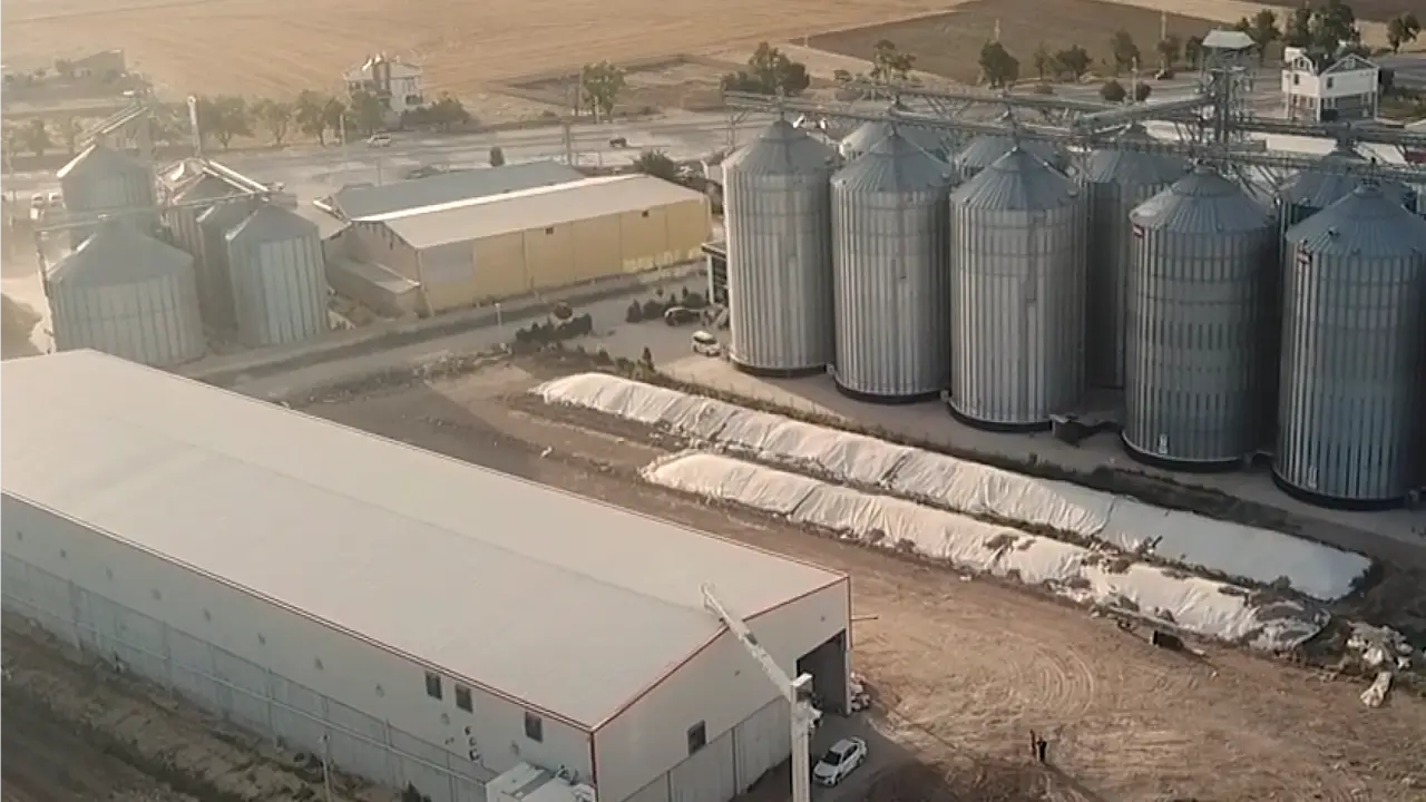 MMCTECH customer facility with turnkey seed processing plant, grain storage silos, and complete agricultural processing infrastructure